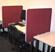 Contour mini panels clamped between bench style desks